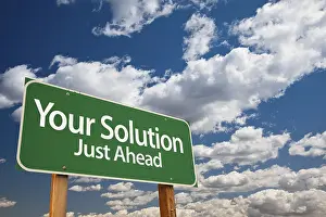 Symbolic Picture Success Drucke: Your solution green road sign over dramatic clouds and sky