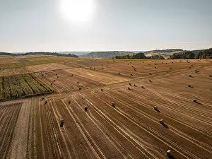 Calw District Landscape Photo Drucke: Spacious fields with straw bales under a bright sky