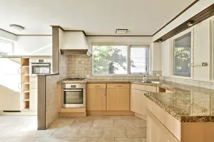 Modern Kitchen Design Drucke: Spacious modern kitchen featuring earthy tones