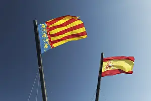 Valencia Spain Drucke: Two Spanish flags in the wind in front of blue sky