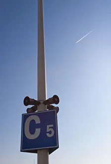 Blue Sky Directional Sign Drucke: Speakers on a lamp post