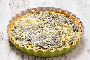 French Baked Goods Drucke: Whole Spinach Tart on the table close up