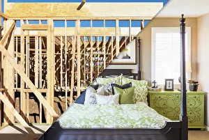 Construction Framing Drucke: Split Screen of Cosntruction Framing and Finished Bedroom