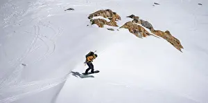 Austrian Mountain Scenery Drucke: Splitboarder jumps, on the downhill