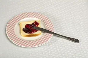 Breakfast Meal Inspiration Drucke: Spread jam on bread with knife