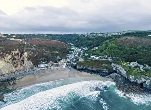 Deserted Beach In England Drucke: St Agnes Beach and cliffs from a drone