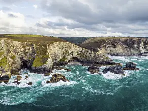Uninhabited Coastal Landscape Drucke: St Agnes cliffs, sae and Waves from a drone