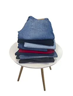 Casual Clothing Style Drucke: A stack of blue, black, light blue