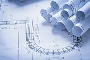 Blueprint Rolls Concept Drucke: Stack of blueprint rolls construction concept