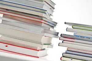 Plain Colored Background Photo Drucke: Stack of books. Released and isolated in front of a white background Austria