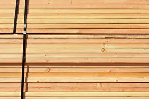 Construction Site Background Drucke: Stack of Building Lumber at Construction Site