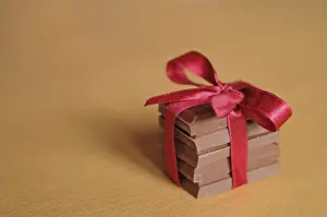 Milk Chocolate Bar Drucke: Stack of chocolate tied with ribbon in a bow