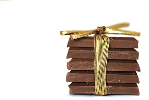 Milk Chocolate Bar Drucke: Stack of chocolate tied with ribbon in a bow