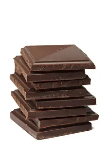 Dark Chocolate Drucke: Stack of dark chocolate isolated on white