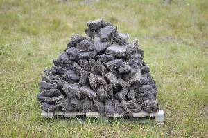 Peat Extraction Europe Drucke: Stack of extracted peat from the Scottish Highland moors