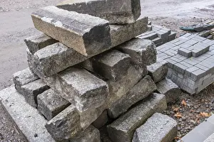 Construction Work Drucke: Stack of kerbstones on a building site
