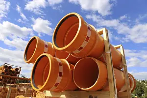 Mutterstadt Construction Site Drucke: Stack of KG pipes on a construction site in the Mutterstadt development area