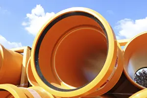 Environmental Pollution In Europe Drucke: Stack of KG pipes on a construction site in the Mutterstadt development area