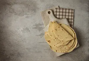 Mexican Tortillas Drucke: A stack of Mexican tortillas, on a gray table