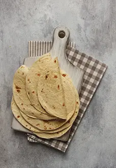 Top Down Perspective Drucke: A stack of Mexican tortillas, on a gray table