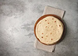 High Calorie Baked Goods Drucke: A stack of Mexican tortillas, on a gray table