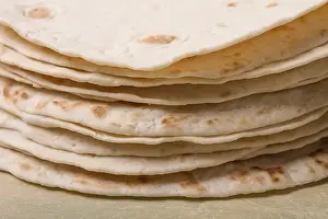 High Angle Food Photography Drucke: A stack of Mexican tortillas, on a gray table