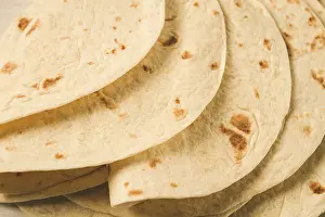 Mexican Tortillas Drucke: A stack of Mexican tortillas, on a gray table