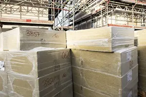 Energy Saving Construction Drucke: A stack of mineral wool insulation boards on a construction site