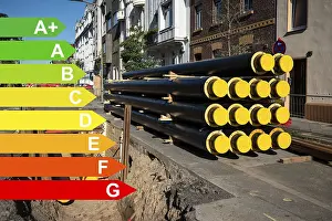 Environmental Pollution Reduction Drucke: A stack of new pipes for district heating at a construction site