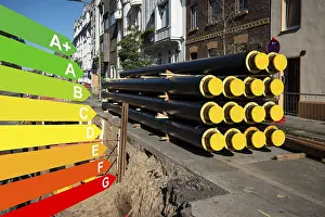 Renewable Energy Solutions Drucke: A stack of new pipes for district heating at a construction site