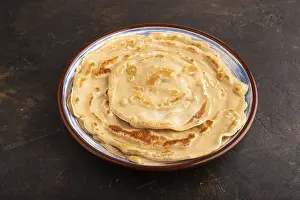 Black Concrete Background Drucke: Stack of Plain Fried pancakes on black concrete background