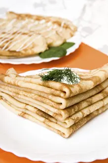 Nutritionally Balanced Food Drucke: A stack of russian pancakes on a white plate