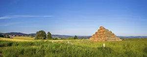 Agricultural Scenery Drucke: Stack of straw bales on field of grass
