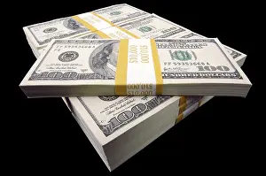 Deserted Studio Still Life Drucke: Stack of ten thousand dollar piles of one hundred dollar bills on a black background