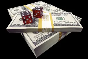 Black Background Studio Photography Drucke: Stack of ten thousand dollar piles of one hundred dollar bills & dice on a black backgro Stack of ten thousand