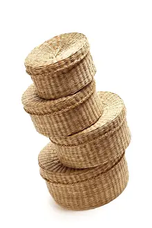 White Studio Backdrop Drucke: Stack of various sized wicker baskets isolated on white