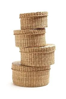 Wicker Baskets Drucke: Stack of various sized wicker baskets isolated on white