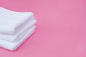 Macro Photography Drucke: Stack white towels pink background