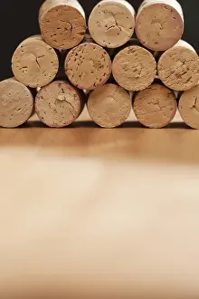 Uninhabited Winery Scene Drucke: Stack of wine corks on a wood surface