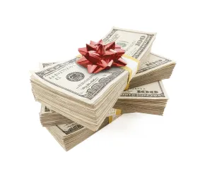 Cash Payment Transaction Drucke: Stacks of one hundred dollar bills with red bow on top