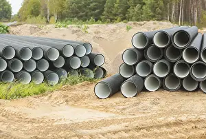Deserted Construction Site Drucke: Two stacks of pipes