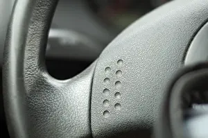 Deserted Road Traffic Drucke: Steering wheel very close up