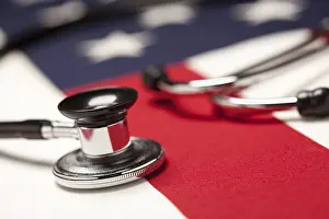 American Flag Stethoscope Drucke: Stethoscope on american flag with selective focus