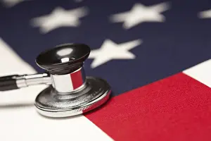 American Flag Stethoscope Drucke: Stethoscope on american flag with selective focus