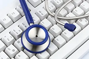 Healthcare Equipment Image Drucke: A stethoscope on a computer keyboard