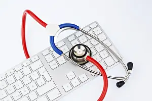 Austria Healthcare System Drucke: Stethoscope and keyboard of a computer