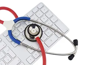 Symbolic Healthcare Image Drucke: Stethoscope and keyboard of a computer