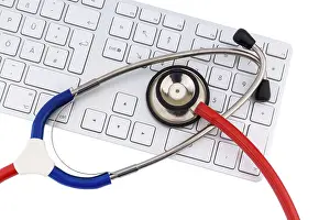 Austria Healthcare System Drucke: Stethoscope and keyboard of a computer