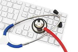 Healthcare Concept Picture Drucke: Stethoscope and keyboard of a computer