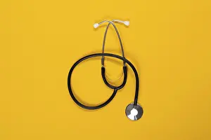 Medical Equipment Drucke: Stethoscope lying in front of a monochrome background